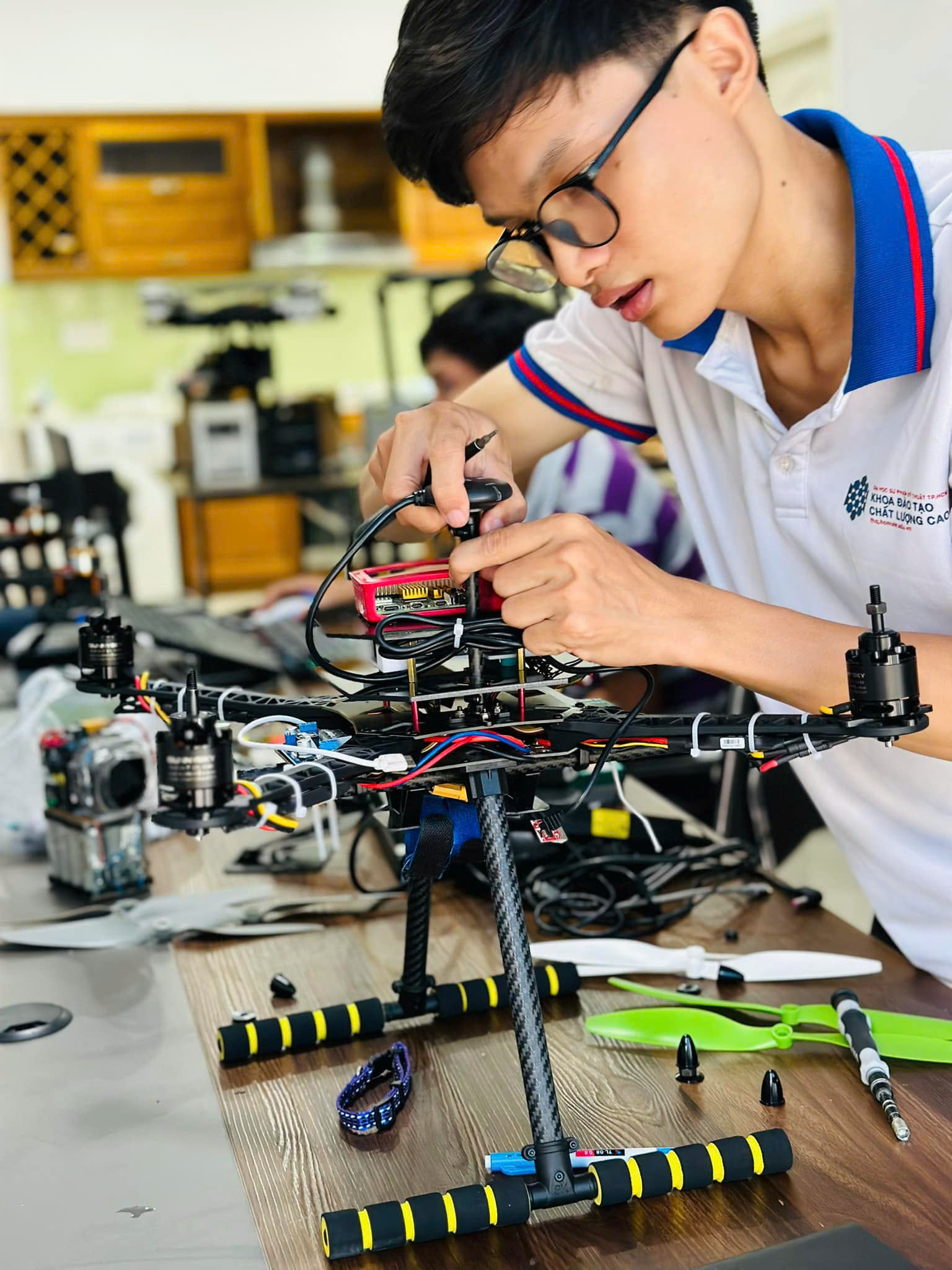 Student assembling drone